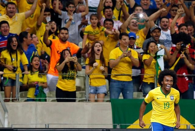 Willian comemora o seu primeiro gol na vitória brasileira sobre a Venezuela. Foto: Reuters.