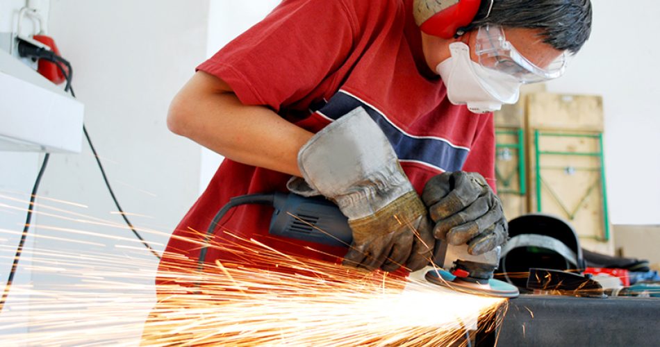 metal worker with a grinder and a lot of sparks
